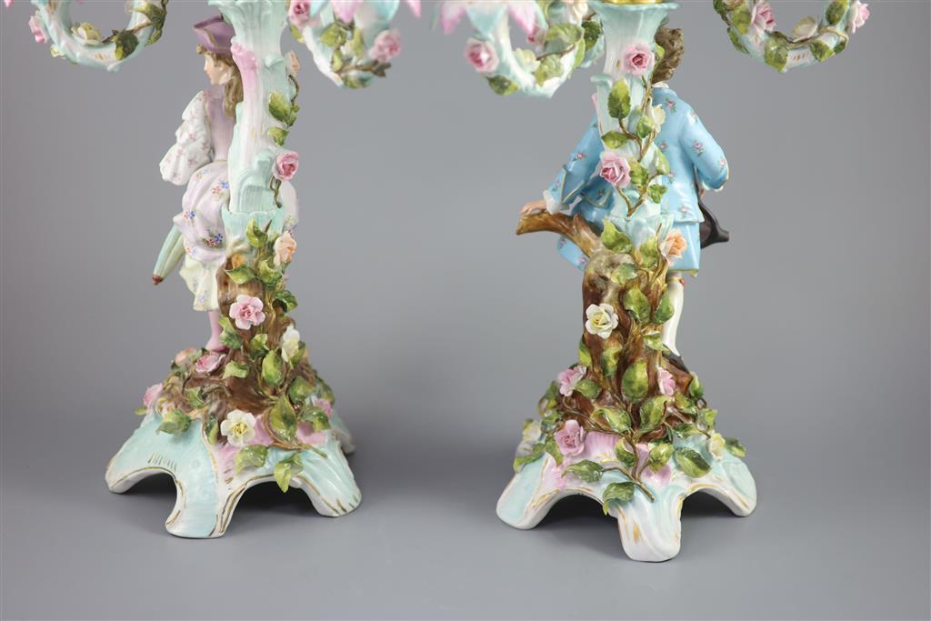 A pair of early 20th century Plaue porcelain figural candelabra, overall height 48cm